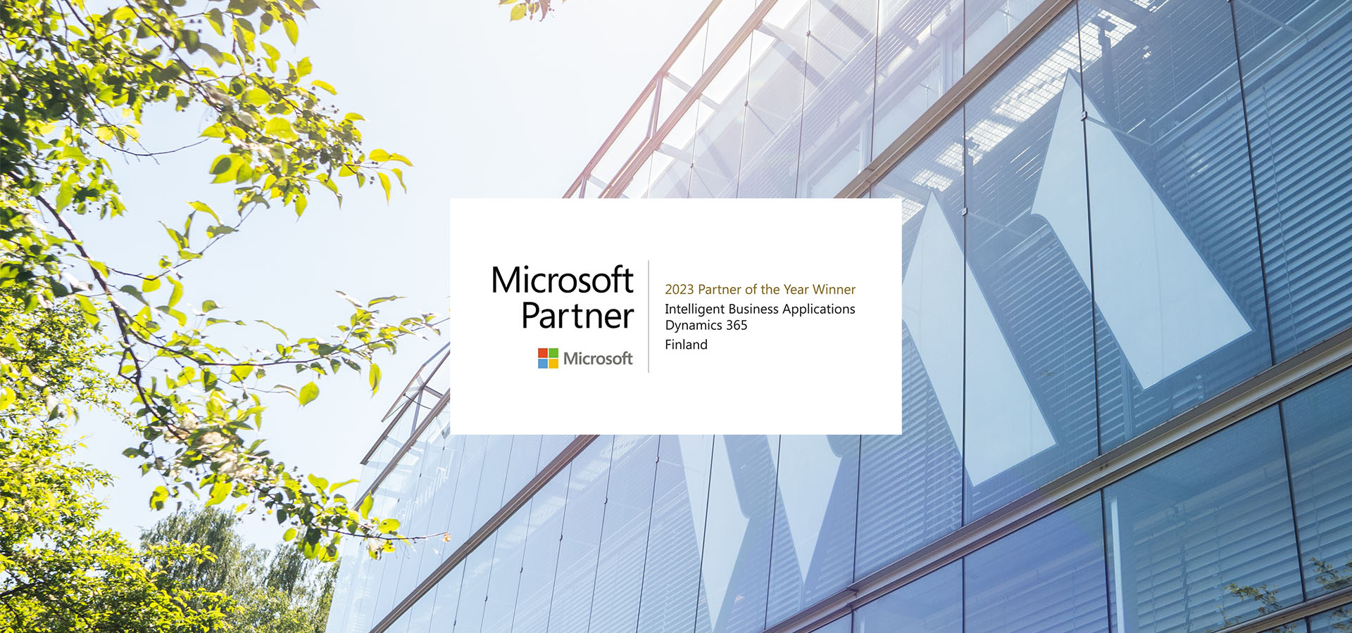 Fellowmind-microsoft partner of the year-2023-hero-with badge.jpg fellowmind office exterior with the partner of the year badge