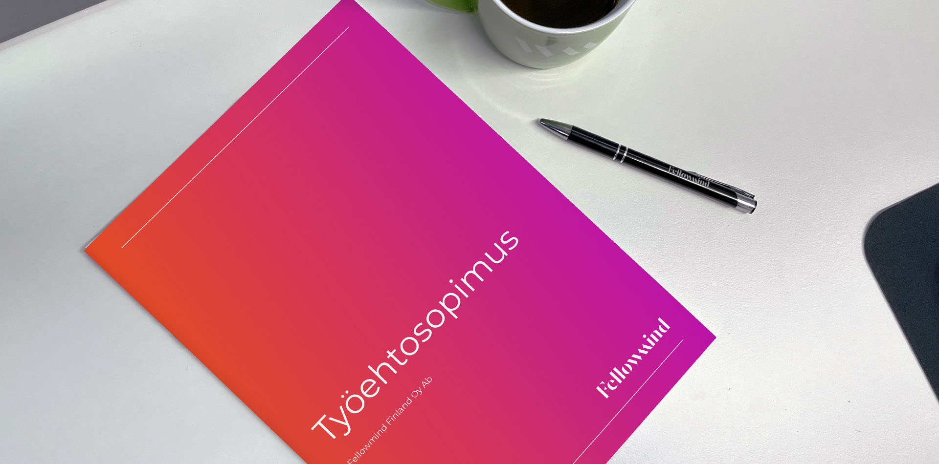 fellowmind-työehtosopimus-hero copy.jpg fellowmind collective agreement document on a table